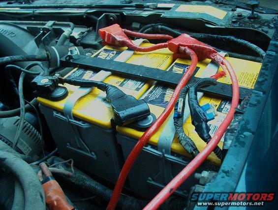 Dual yellow top batteries with red and black wiring in an engine bay