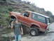 1988 Ford Bronco - Ford Bronco navigating rough terrain on a dirt path.