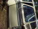1979 Ford Bronco - This is a close-up of a tan and brown Ford van door, with the door open.