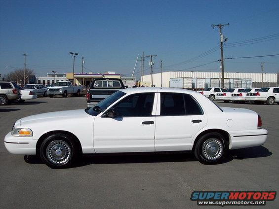 White 1999 Ford Crown Victoria sedan, side view