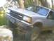 1991 Mazda Navajo - This silver SUV navigates a rocky trail, its Mazda grille clearly visible.