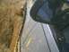 1991 Mazda Navajo - Vehicle is stuck in a muddy rut, with dirt and mud splattered on its side.