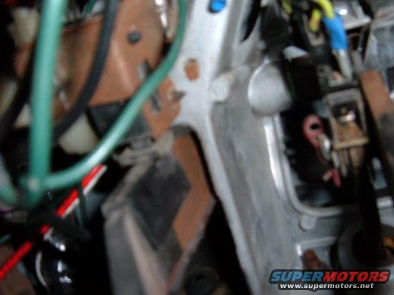 Close-up of clutch pedal assembly and wiring with Supermotors.net watermark