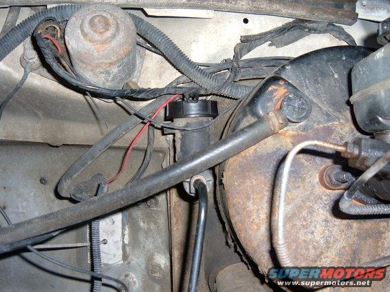 1985 Ford F-150 clutch master cylinder and brake booster assembly, showing rust and wiring
