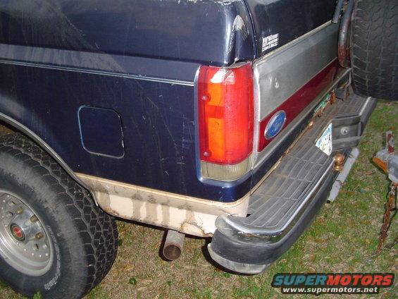 1989 Ford Bronco rear corner showing taillight, bumper, and spare tire mount
