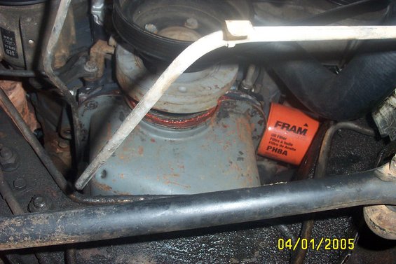 Orange Fram oil filter in engine bay