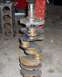 1994 Ford F-150 - A crankshaft and engine block are shown in a workshop setting.