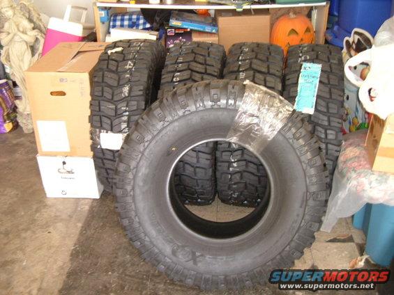 dscf0867.jpg All five 315 x 75R x 16 Pro Comp Xterrain tires sitting in my moms garage, out of the way, and just waiting for someone to mount them on some rims.