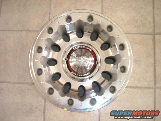 dscf0868.jpg Rim shown with the Center cap.  Since my Bronco currently has auto locking hubs, I will probably put some spacers behind the wheels to increase my the width of the vehicles stance, but I will then be able to completely cover the hubs with these cool looking caps.