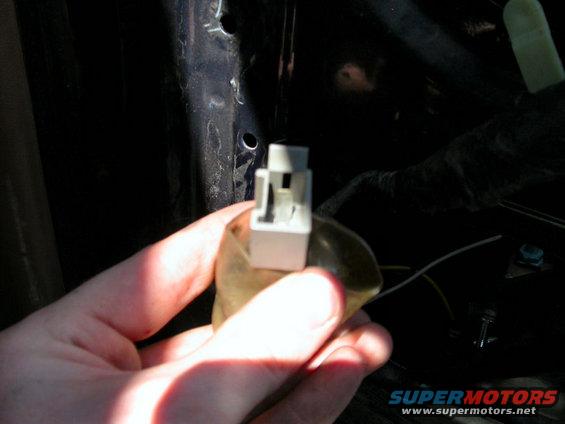 truck-pictures-011.jpg This is what you must take off before disconnecting all three screws. If not, the motor will fall, possibly tearing these wires. Just bend back the plastic and remove the connection.