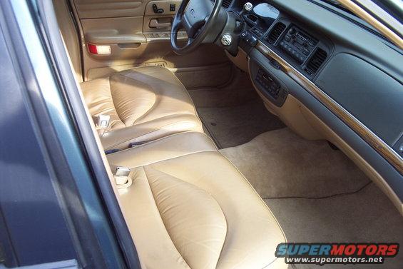 1996 Ford Crown Victoria interior showing tan leather seats and dashboard