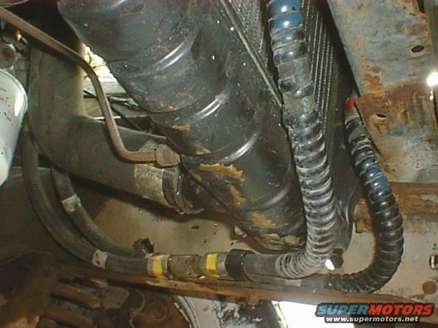 dsc00070.jpg Here is where the lines are routed. Very clean and easy. Nothing in the way but I did fold a small tab on the bottom of the radiator side support bracket flat to give just a little more clearance. It did not actually hit but it was a sharp edge and closer than I liked. I just grabbed it with pliers and bent it flat.