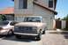 1988 Ford Bronco - This Ford F-150 pickup truck is parked in front of a house with another car beside it.