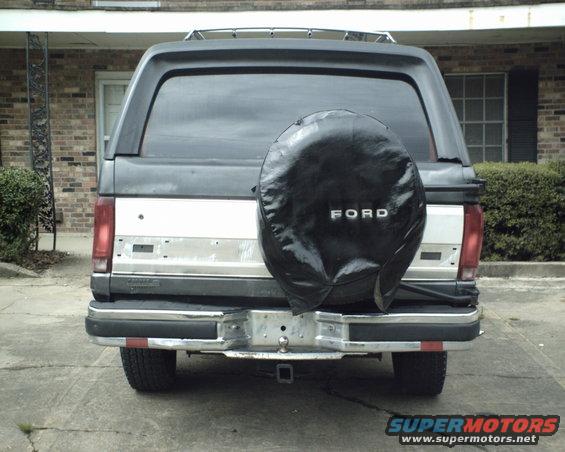 Rear view of a 1987 Ford Bronco with a black spare tire cover showing 'FORD'