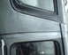 1987 Ford Bronco - Detail of a vehicle body panel, showing window trim and a watermark.