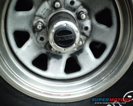 Close-up of a wheel hub with a black center cap