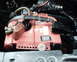 1987 Ford Bronco - A red Optima car battery is visible in the engine bay, connected to various cables.