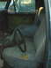 1976 Ford F-250 - Not a pretty seat but a good start. I found two identical 89 F150 front seats with arm rests for $5.00 each! since they match the upholster…