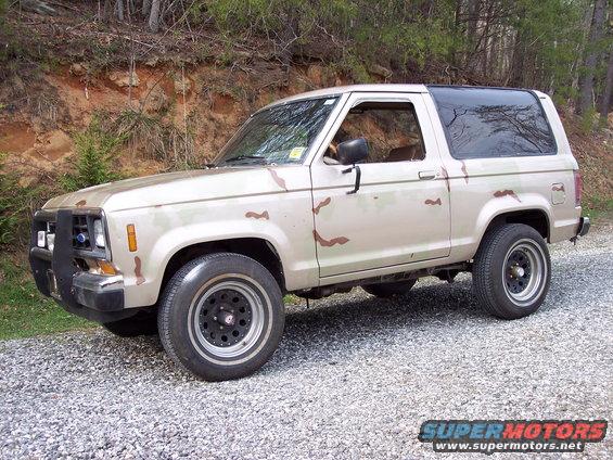 mirage.jpg 98% Complete
-Need to cut and buff
-Remount emblems
-Repaint tires to match the hammered black on the rest of the car.

Just thought you might want to see how she looks. ;-)