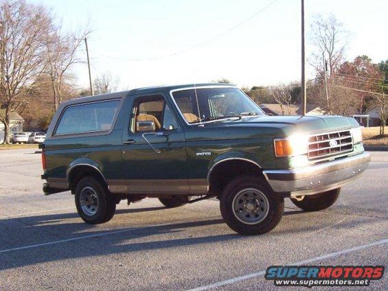 Green Ford Bronco parked outside