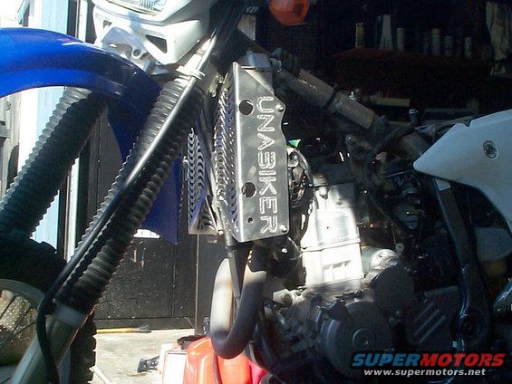Motorcycle radiator guard with UNABIKER text