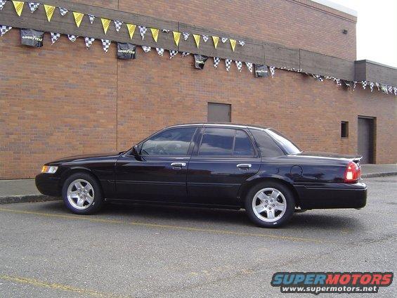 Black 1999 Mercury Grand Marquis sedan, side view