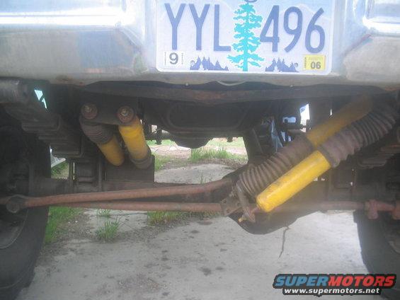 Rear suspension and differential with yellow shocks and license plate YYL 496 dated 91
