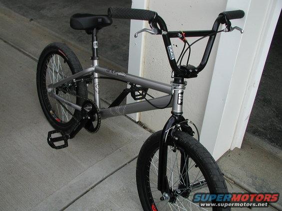 Silver BMX bicycle with black handlebars and seat