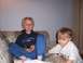1983 Ford Bronco - Two young boys are relaxing on a couch, one holding a flip phone and the other reaching out.