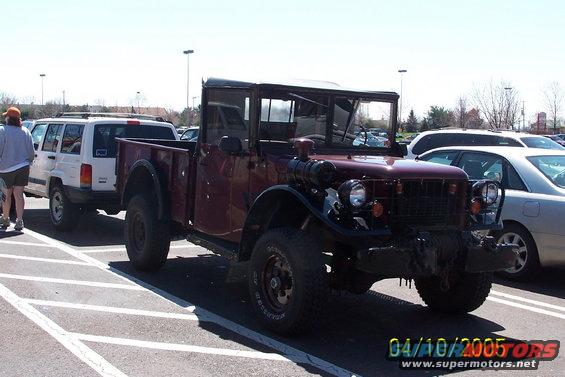 Maroon pickup truck with black roof and bed, seen from a 3/4 front angle