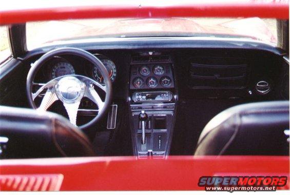 1971 Chevrolet Corvette interior showing steering wheel, dashboard gauges, center console with shifter, and seats