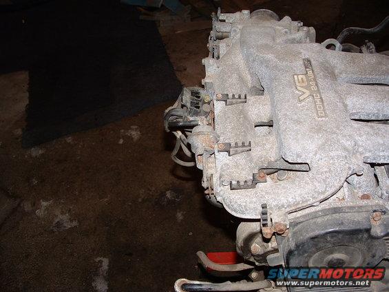 Close-up of a V6 DOHC 24-Valve engine intake manifold, possibly from a Mazda or Ford