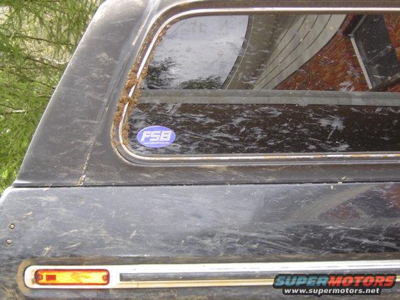 dirty SUV side with FSB sticker on rear window