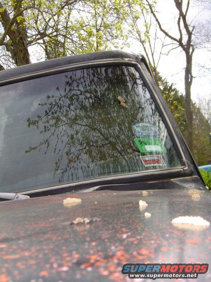 1979 Ford Bronco windshield with green and red stickers