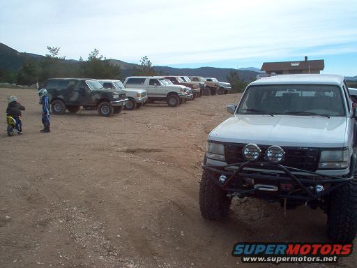 White Ford Bronco with off-road bumper and lights