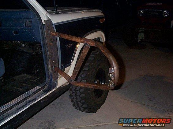 Side view of a 1986 Ford Bronco with custom tube doors and off-road tires