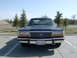 1990 Ford Crown Victoria - The front grille and headlights of a 1990 Ford Crown Victoria are visible.