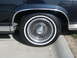 1990 Ford Crown Victoria - Close-up of a 1990 Ford Crown Victoria's wheel and tire assembly.