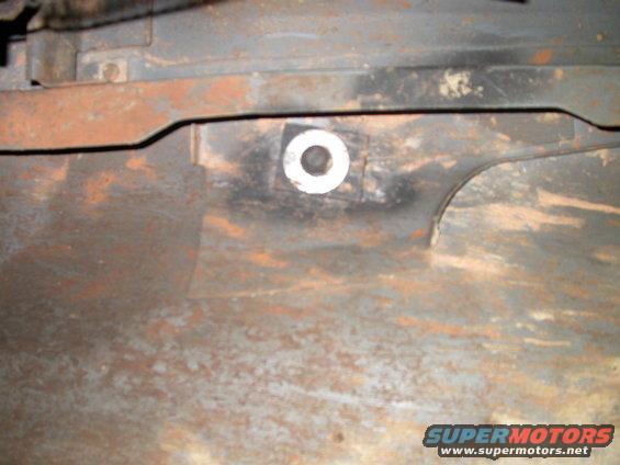 dscn1858.jpg This is the repair to my floor board where one of the drivers seat bolts tried to pull through and tore part of the sheet metal.  I welded the floor crack and then put this metal strip under the bolt to more evenly distribute the force and hopefully keep it from tearing out again.