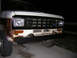 1986 Ford Bronco II - Front view of a 1986 Ford Bronco II showing its grille and bumper, with visible rust.