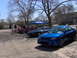 2003 Mazda Protege - Blue 2003 Mazda Protege sedan at a car show with other vehicles present.