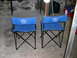 1994 Ford Bronco - Two blue Ford Bronco camping chairs are shown in a basement setting.