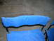 1994 Ford Bronco - Close-up of blue fabric stretched over metal poles, likely parts of a folding chair.