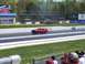 1978 Ford F-250 - A red 1971 Ford Mustang Mach 1 races down the drag strip, with spectators in the foreground.