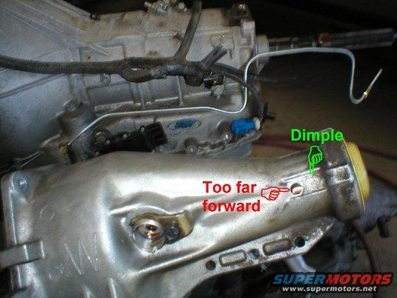 08drilledbent.jpg I drilled too far forward - I should have drilled in the dimple of the casting.  Considering the rotation of the driveshaft & the location of the drain in the bushing, I'll do the next one on the passenger side, and  wrap the brake line over.