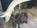 1986 Ford Bronco - Front suspension components, including brake assembly and coil spring, are visible.
