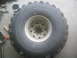 1983 Ford F-250 - A close-up view of a large off-road tire and wheel assembly.