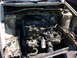 1998 Volkswagen Jetta - The engine bay of a 1998 Volkswagen Jetta is shown with the engine partially disassembled.