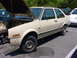 1998 Volkswagen Jetta - This beige sedan, likely a 1984 Volkswagen Jetta, is parked with its hood open and front bumper removed.