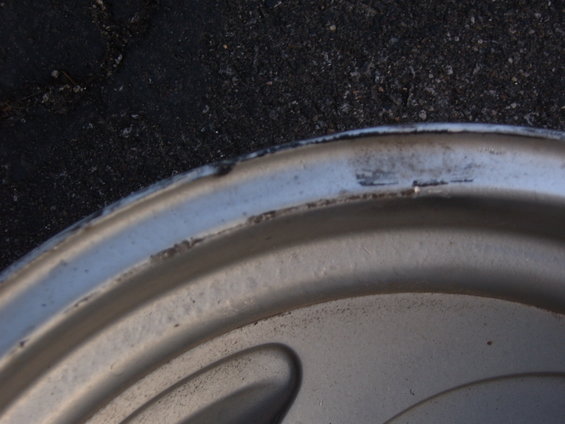 Close-up of a silver wheel rim with minor scuffs